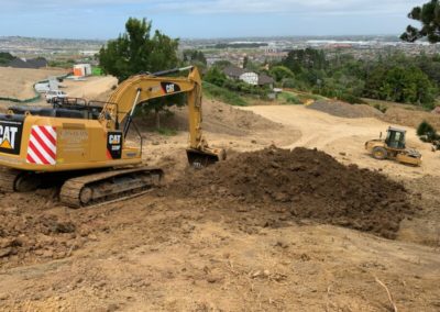 Cat digger digging site foundations