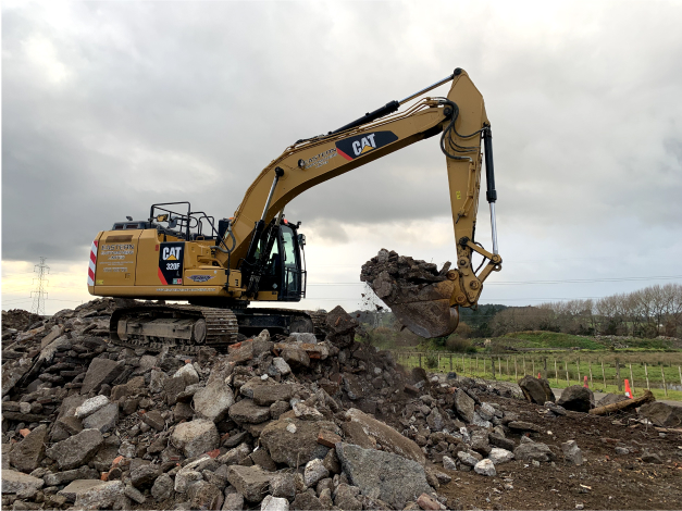 digger on concrete mound digging